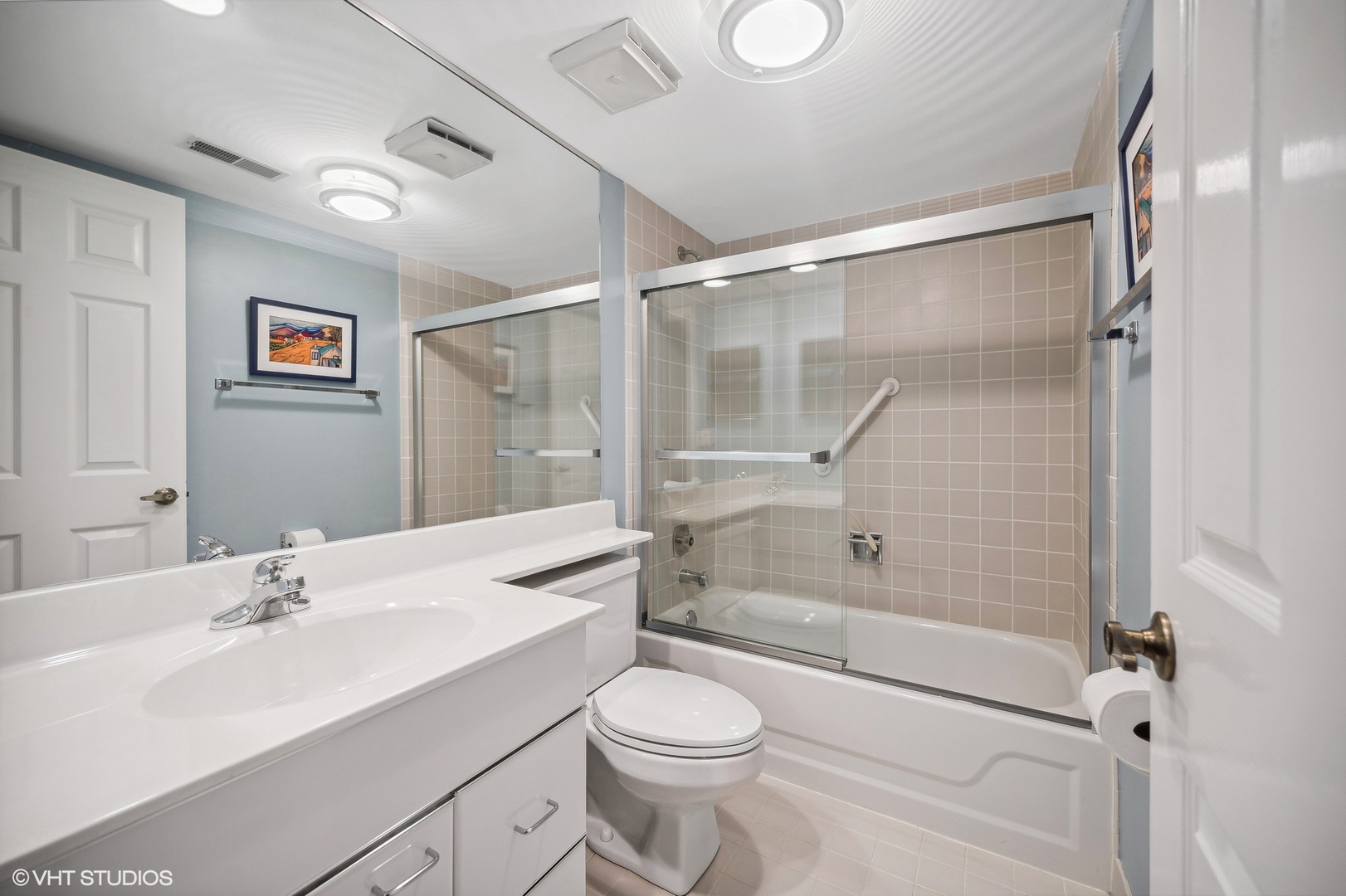 710 Waukegan Road, Unit 303 Glenview, IL 60025 - Photo 12 of 15 a bathroom with a sink toilet and shower
