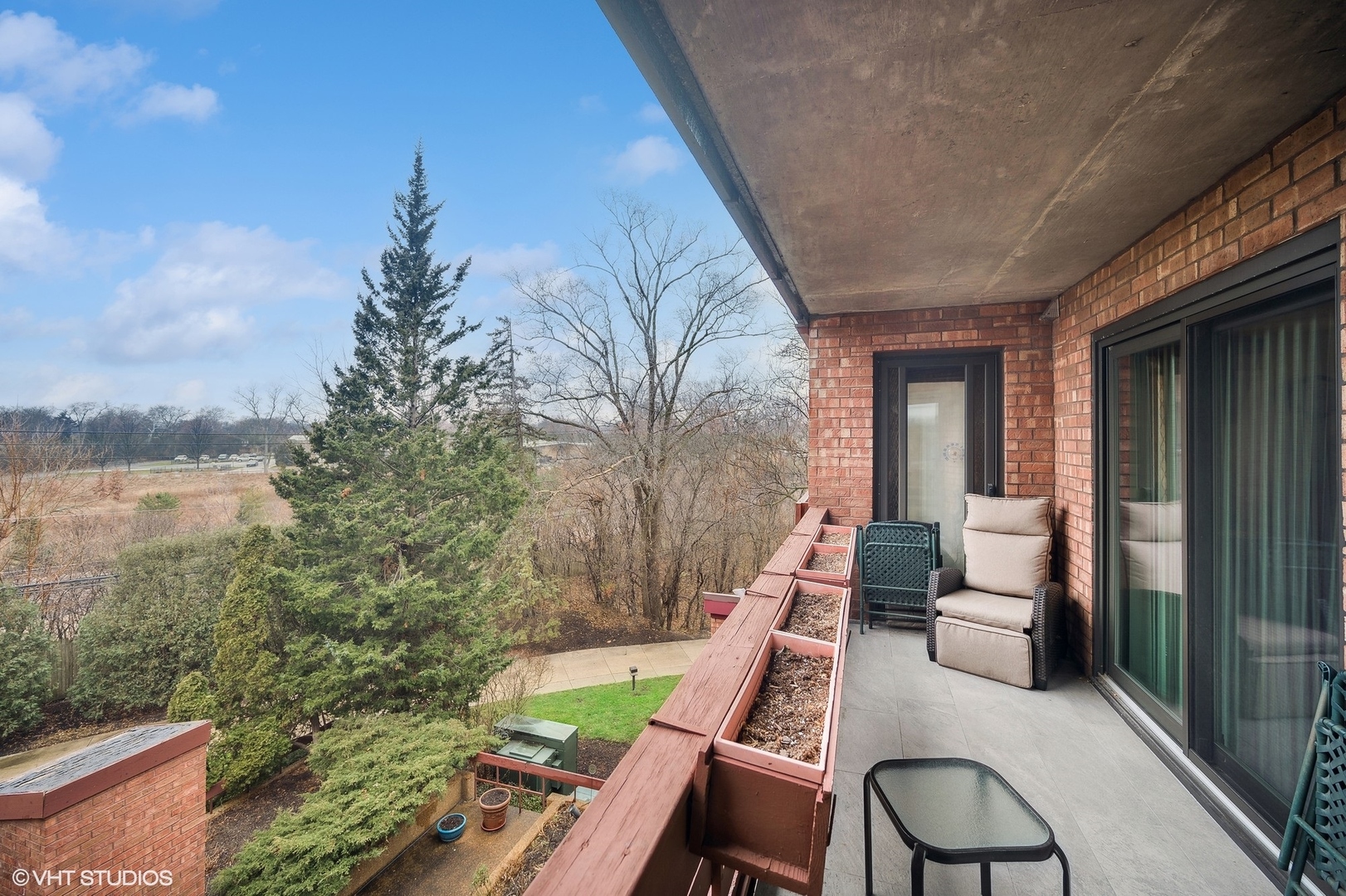 710 Waukegan Road, Unit 303 Glenview, IL 60025 - Photo 7 of 15 a view of balcony with furniture