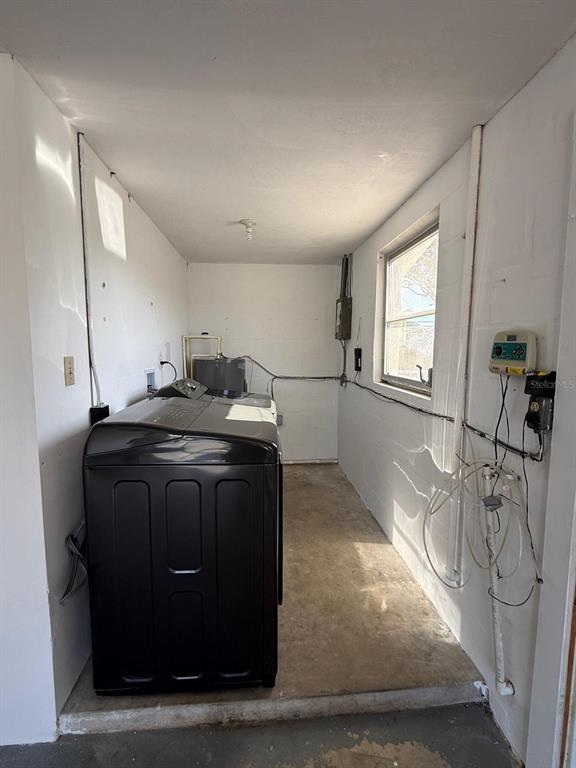 7808 Talisman Drive Port Richey, FL 34668 - Photo 19 of 20 a kitchen with a sink a stove and cabinets