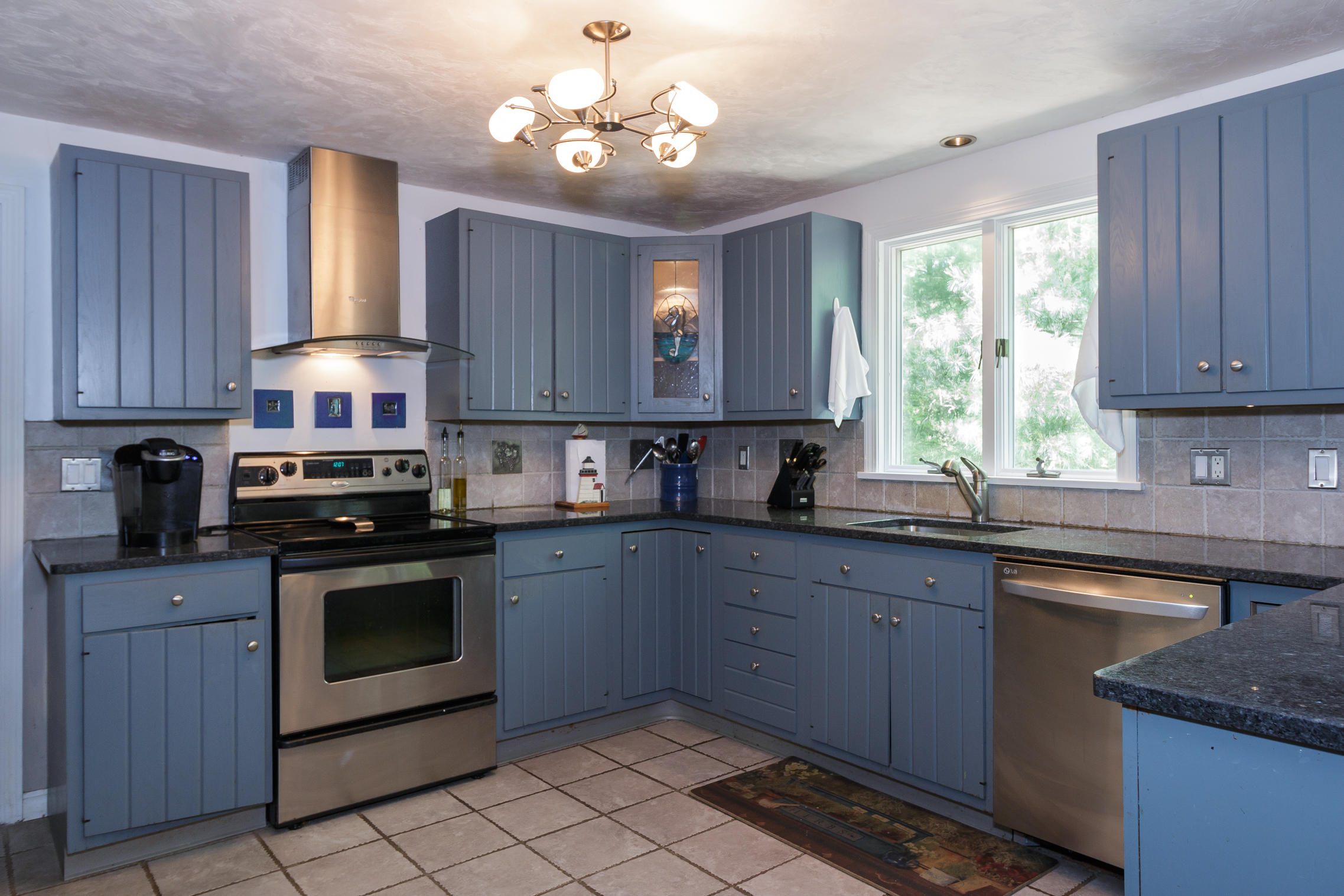 40 Frederick Road Falmouth, MA 02540 - Photo 3 of 19 a kitchen with a stove sink and cabinets