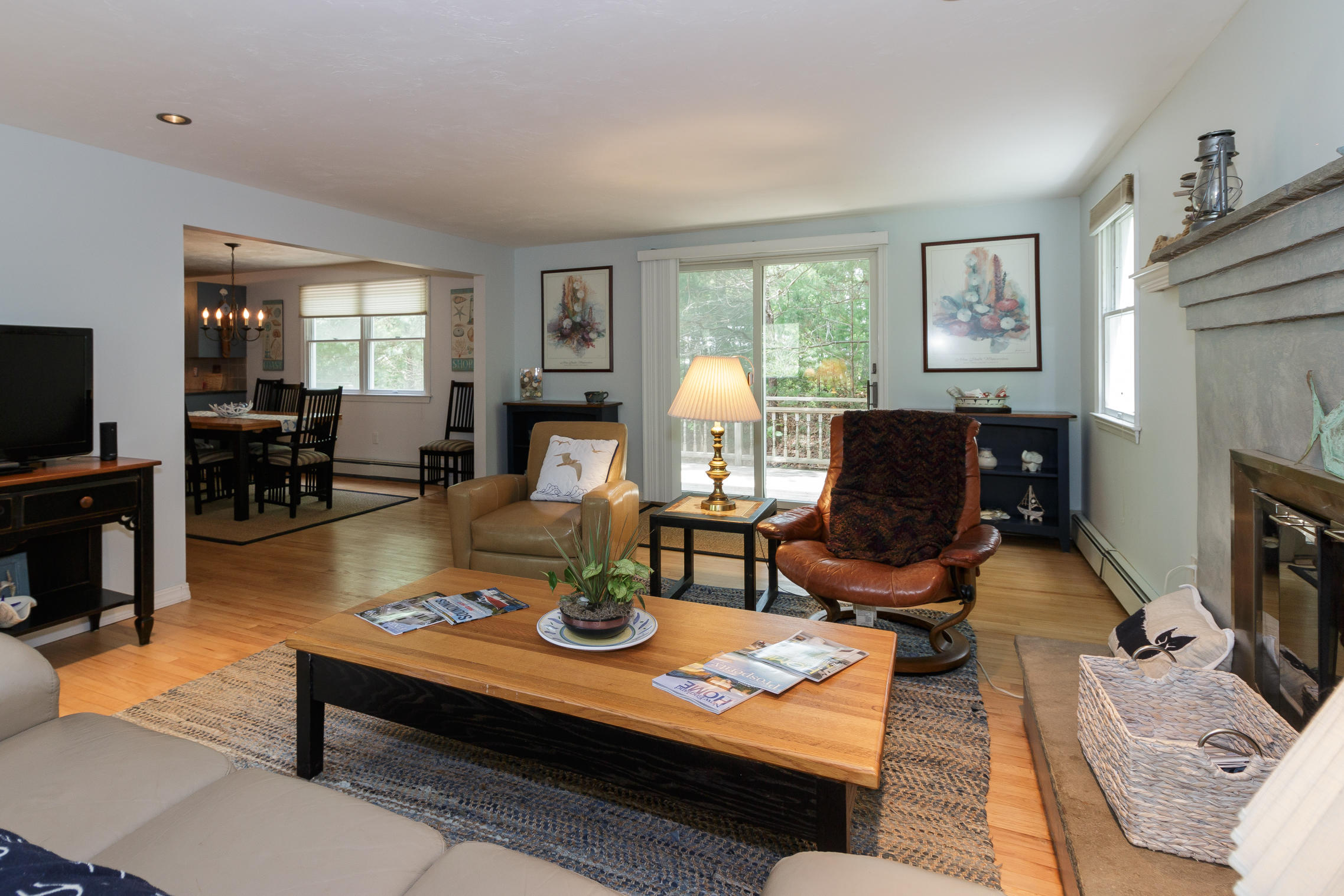 40 Frederick Road Falmouth, MA 02540 - Photo 7 of 19 a living room with furniture a fireplace and a flat screen tv