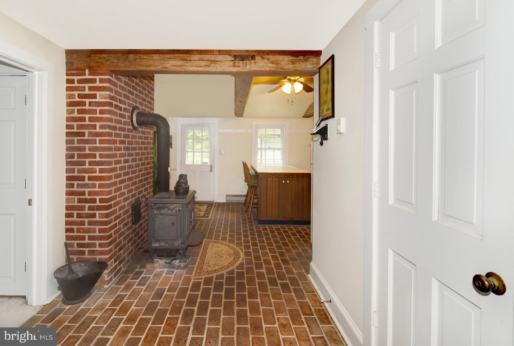 15 Oldfield Point Road Elkton, MD 21921 - Photo 7 of 24 Brick flooring, wood stove