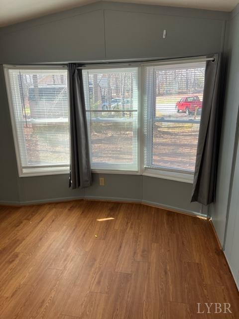 468 Hawkins Road Evington, VA 24550 - Photo 17 of 31 a view of an empty room with wooden floor and a window