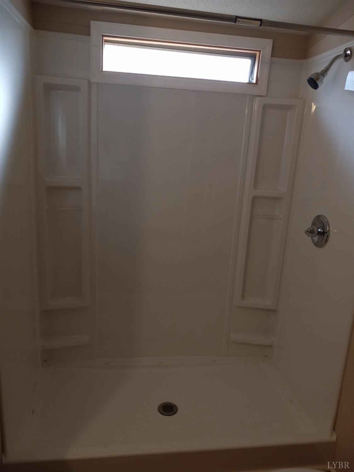 468 Hawkins Road Evington, VA 24550 - Photo 19 of 31 a bathroom with a shower