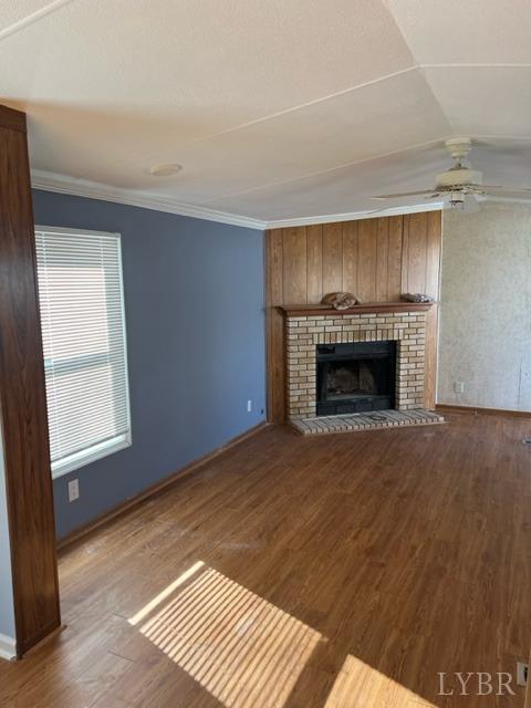 468 Hawkins Road Evington, VA 24550 - Photo 5 of 31 an empty room with wooden floor fireplace and windows