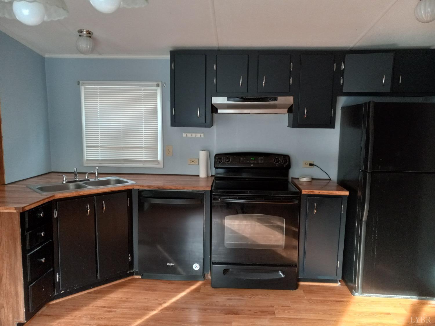 468 Hawkins Road Evington, VA 24550 - Photo 6 of 31 a kitchen with a sink and cabinets