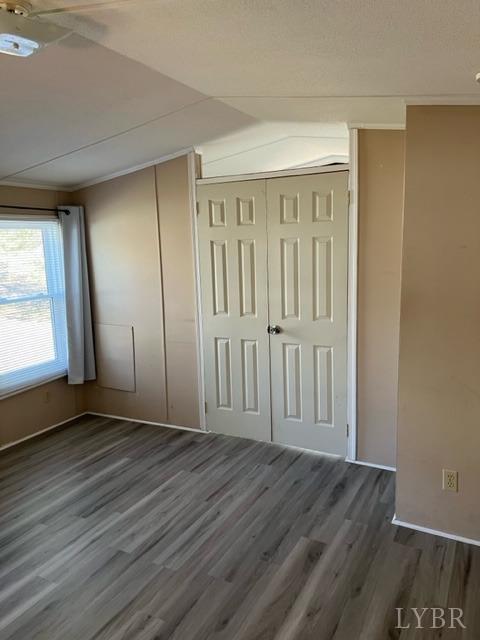 468 Hawkins Road Evington, VA 24550 - Photo 8 of 31 an empty room with wooden floor and windows