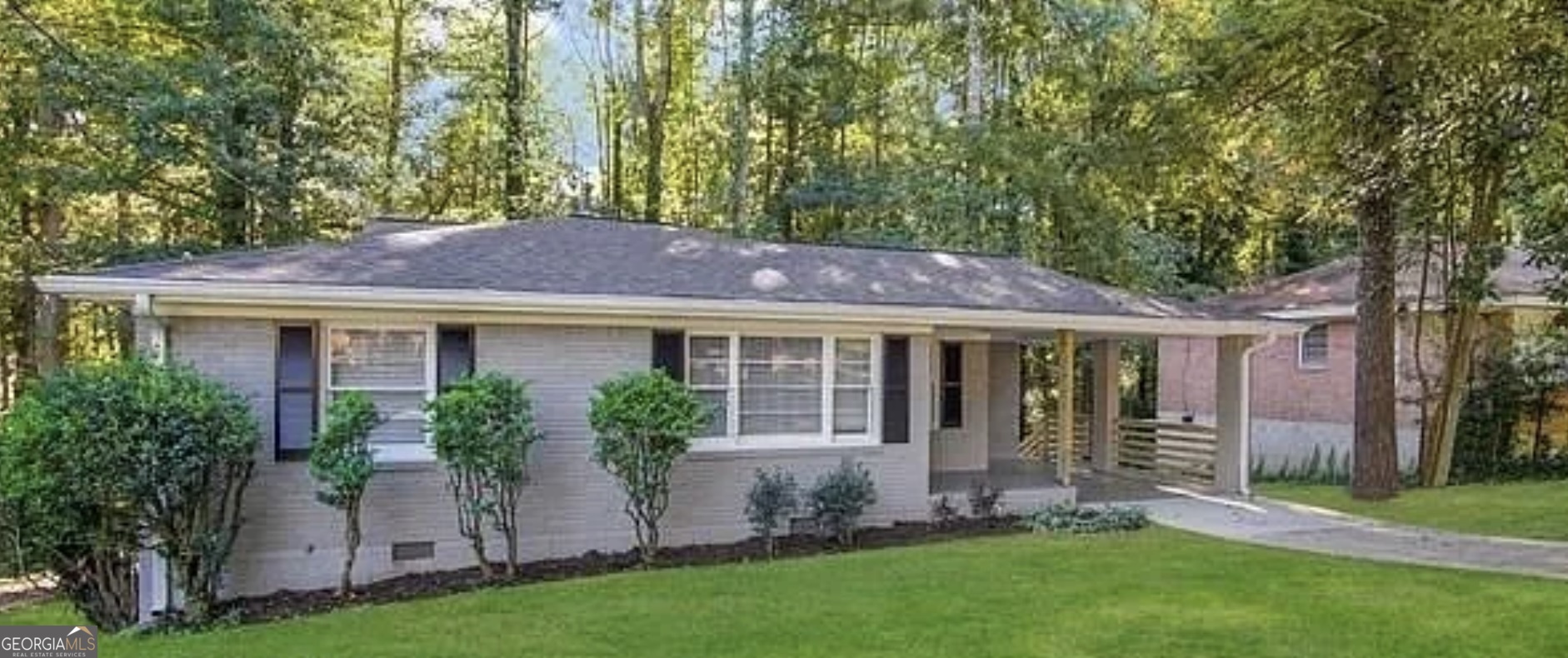 a view of house with a yard