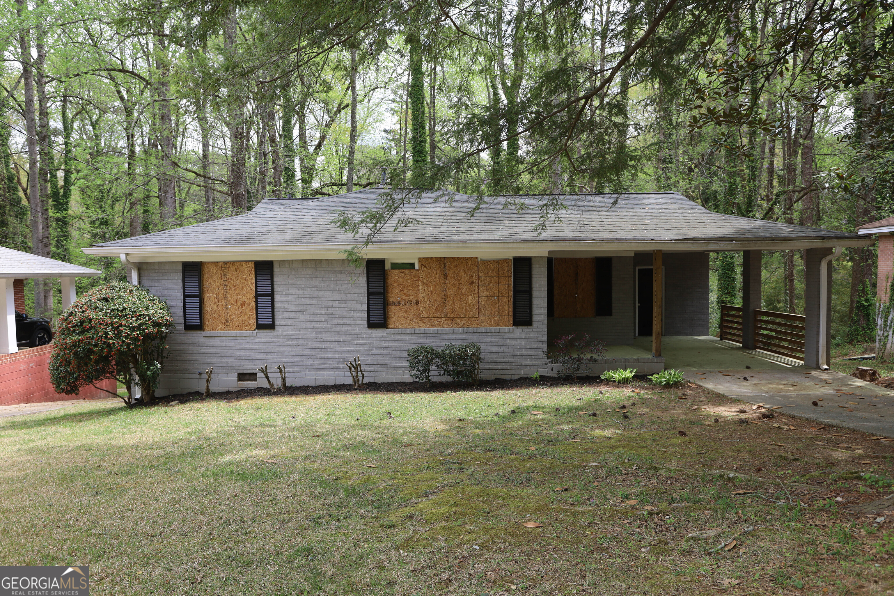 2364 Farley Street East Point, GA 30344 - Photo 2 of 10 a front view of a house with a garden
