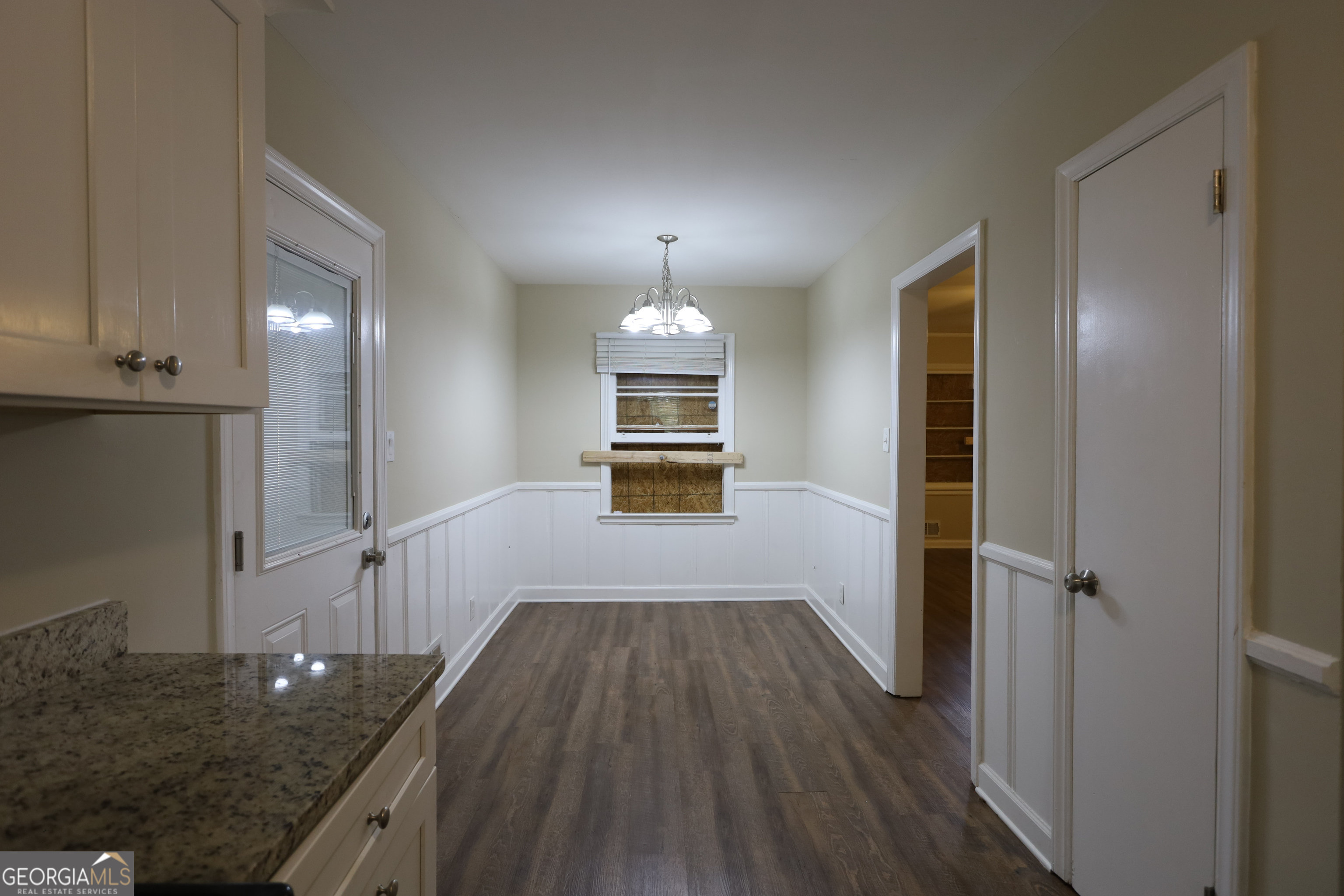 2364 Farley Street East Point, GA 30344 - Photo 3 of 10 wooden floor in an empty room with a kitchen