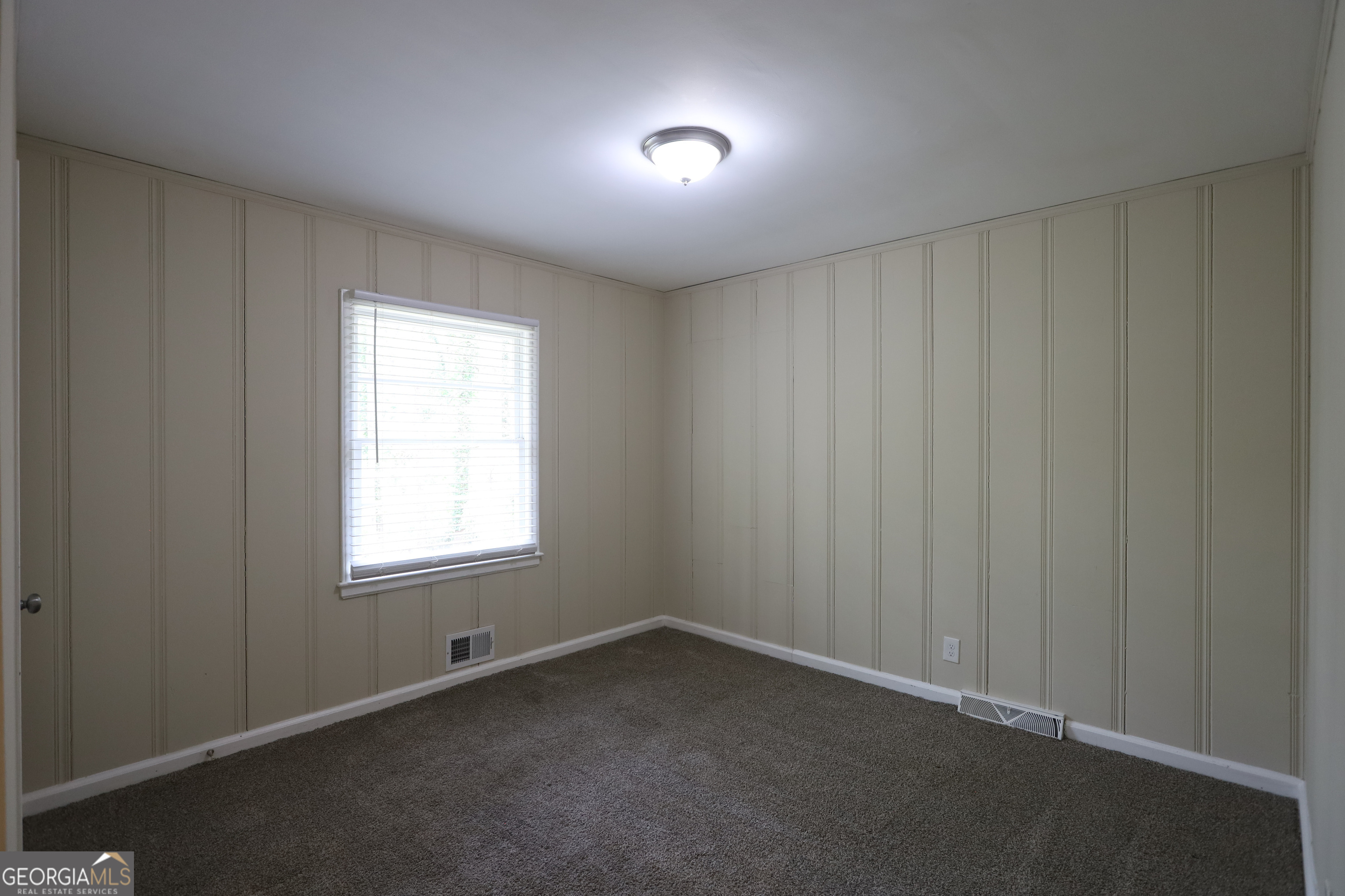 2364 Farley Street East Point, GA 30344 - Photo 6 of 10 an empty room with a window