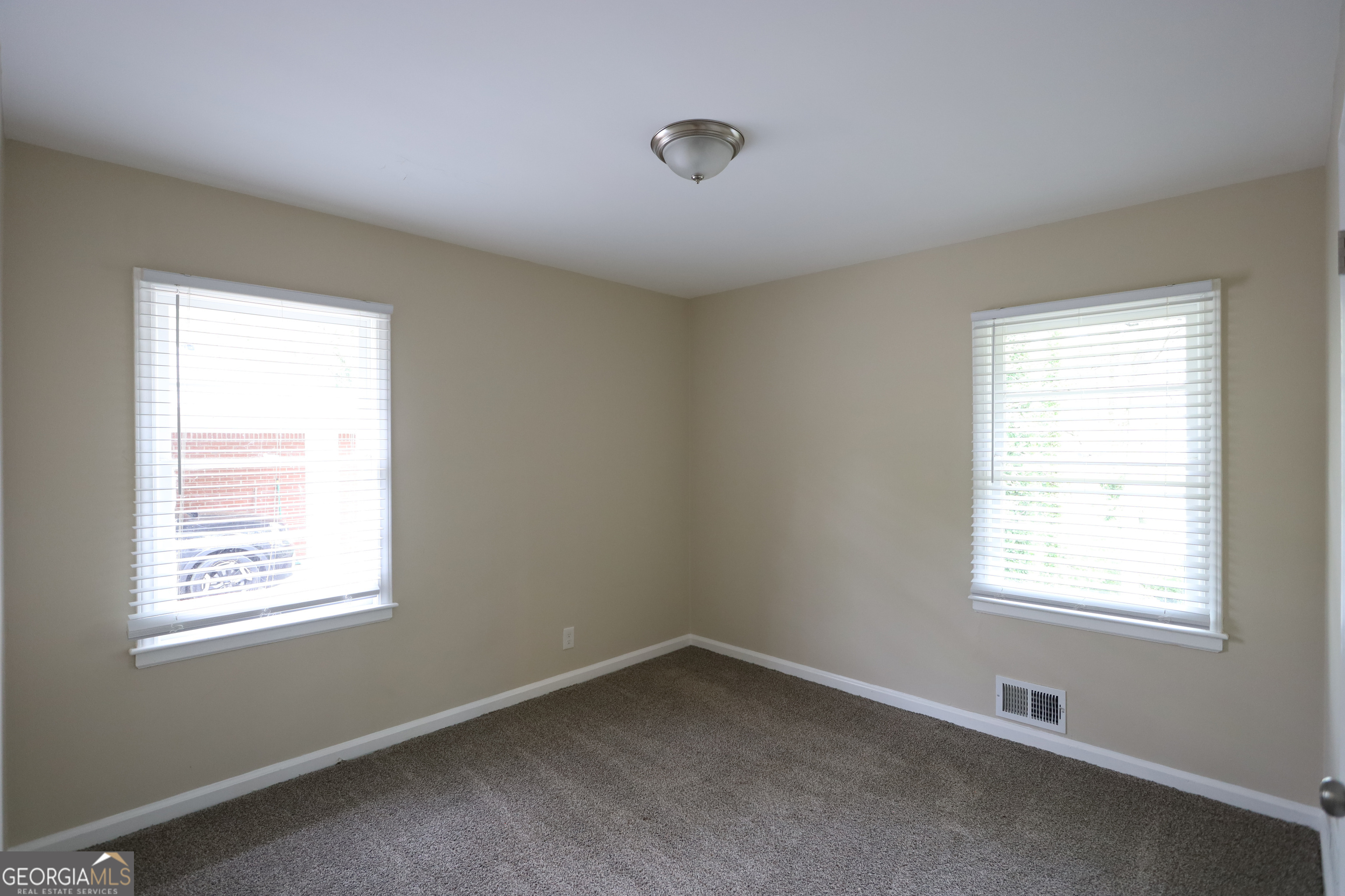 2364 Farley Street East Point, GA 30344 - Photo 7 of 10 an empty room with a window