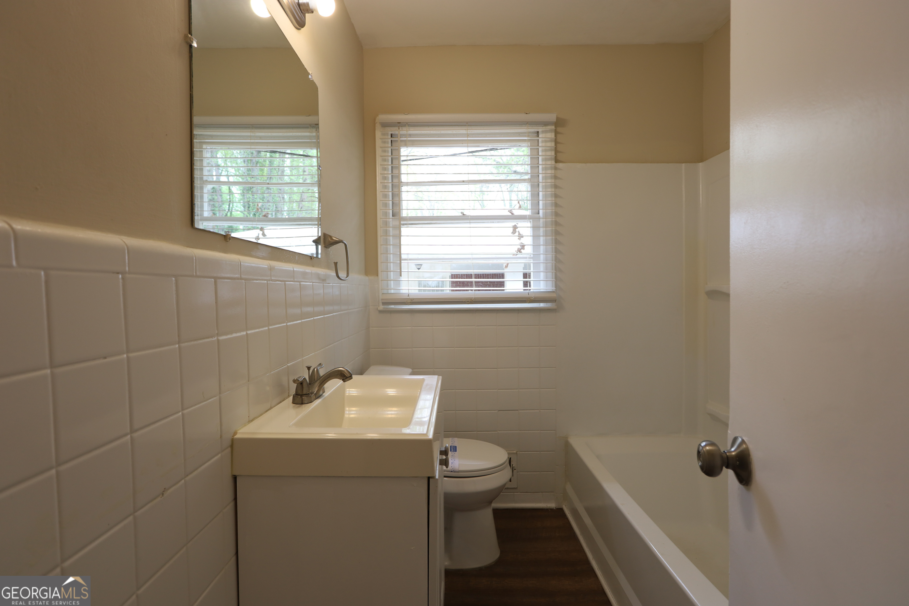 2364 Farley Street East Point, GA 30344 - Photo 8 of 10 a bathroom with a sink toilet and window