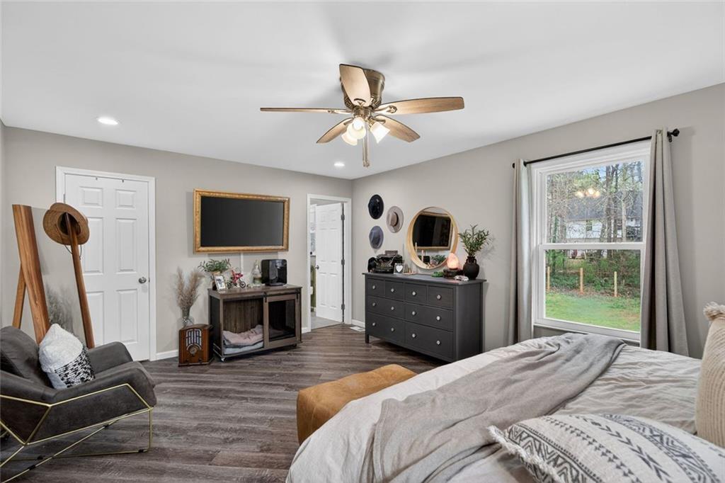 7280 Valley Drive Winston, GA 30187 - Photo 21 of 35 a bedroom with furniture a flat screen tv and a window