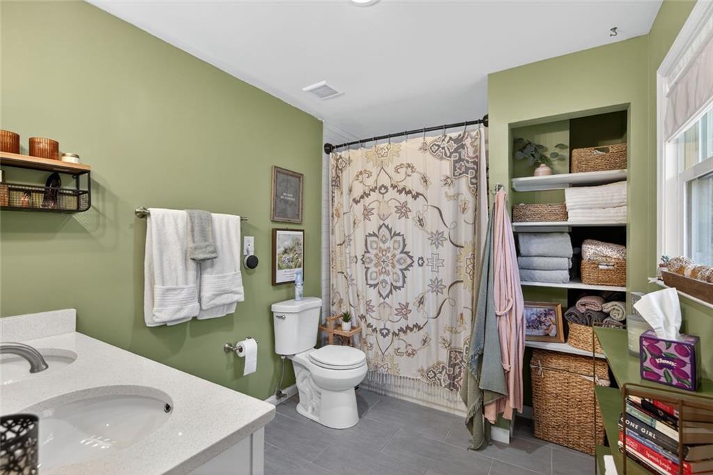 7280 Valley Drive Winston, GA 30187 - Photo 22 of 35 a bathroom with a toilet sink and a shower