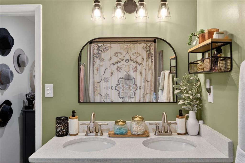 7280 Valley Drive Winston, GA 30187 - Photo 23 of 35 a bathroom with a sink mirror and vanity