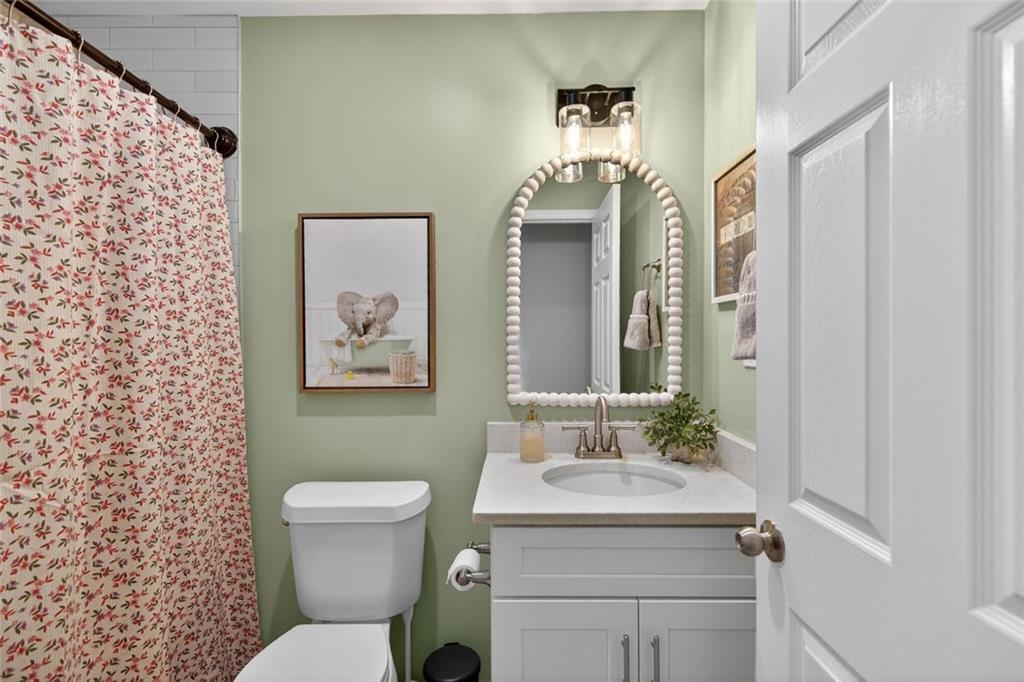7280 Valley Drive Winston, GA 30187 - Photo 25 of 35 a bathroom with a granite countertop sink toilet and shower