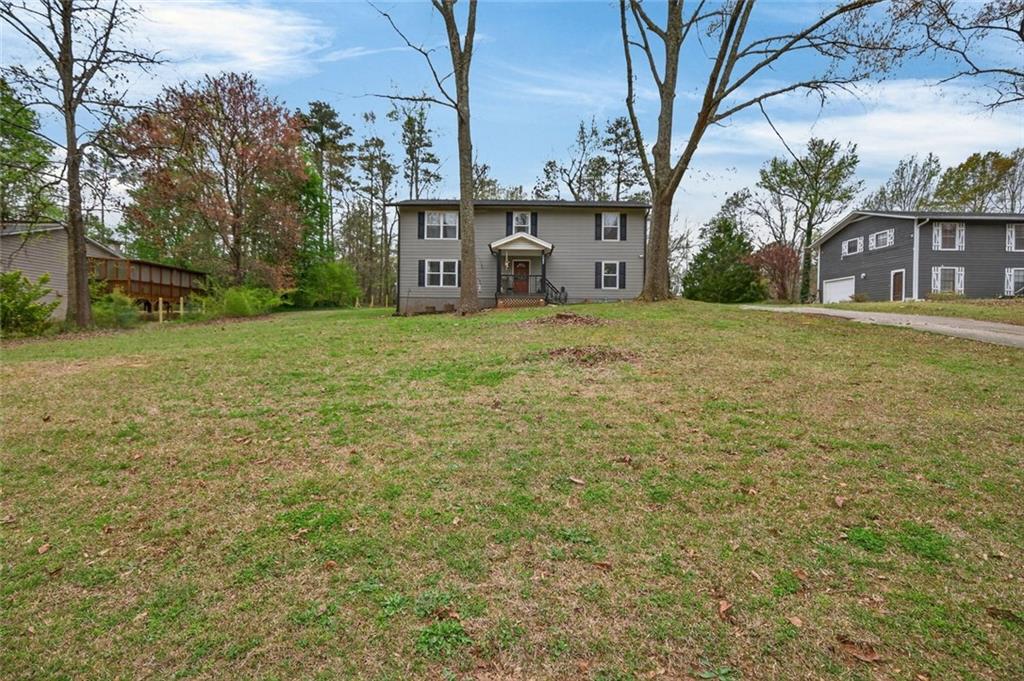7280 Valley Drive Winston, GA 30187 - Photo 6 of 35 a backyard of a house with lots of green space