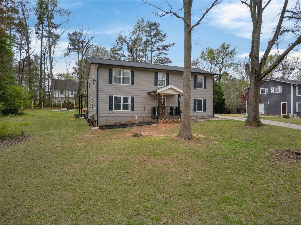 7280 Valley Drive Winston, GA 30187 - Photo 7 of 35 front view of a house with a big yard