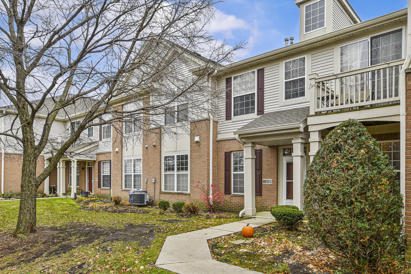 8815 Concord Lane, Unit G Justice, IL 60458 - Photo 1 of 27 a front view of a house with a yard