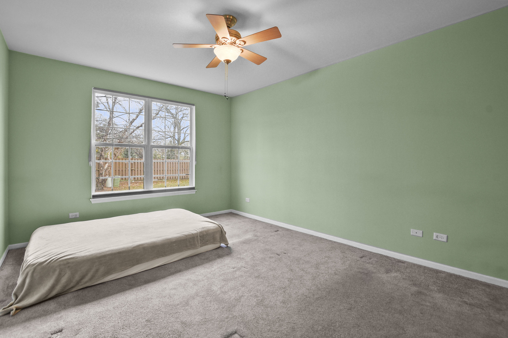 8815 Concord Lane, Unit G Justice, IL 60458 - Photo 16 of 27 a bedroom with a bed and a window