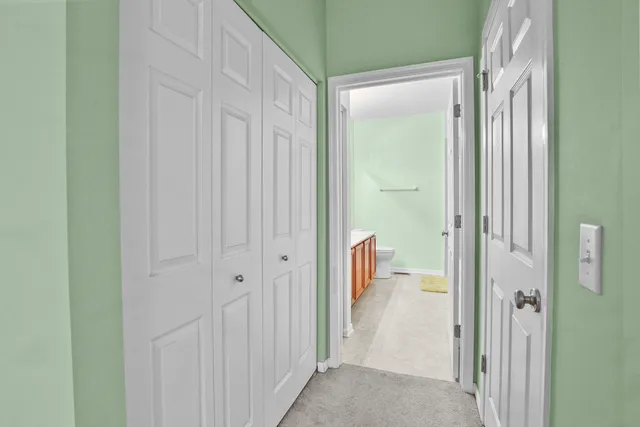 a view of a bathroom from a hallway