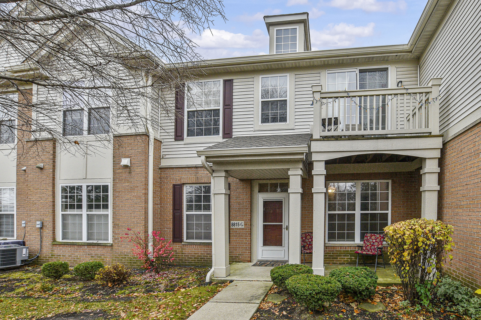 8815 Concord Lane, Unit G Justice, IL 60458 - Photo 25 of 27 front view of a brick house with a large windows