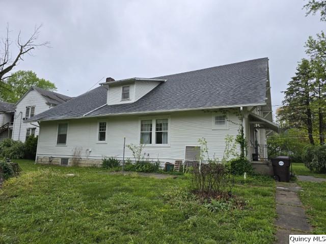 242 Main Street Carthage, IL 62321 - Photo 27 of 28 a front view of a house with garden