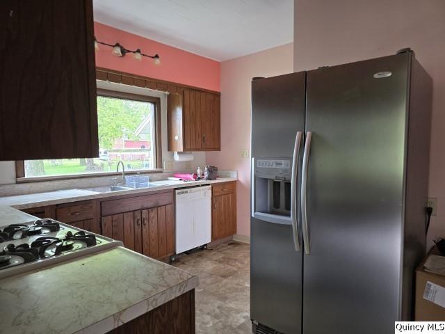 242 Main Street Carthage, IL 62321 - Photo 3 of 28 a kitchen with stainless steel appliances granite countertop a refrigerator and a sink