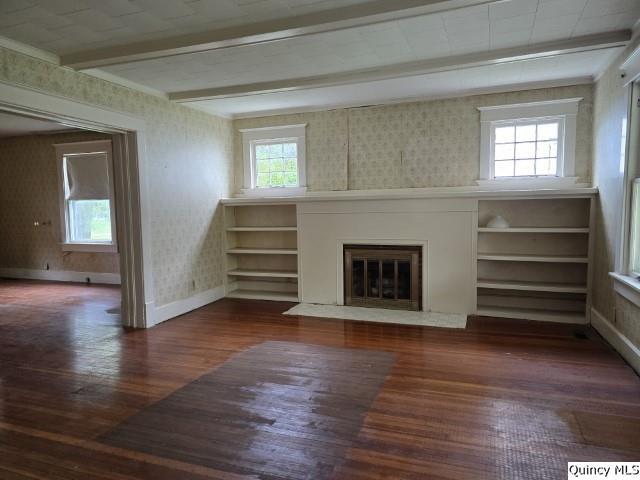 242 Main Street Carthage, IL 62321 - Photo 9 of 28 a view of an empty room with a fireplace and a window