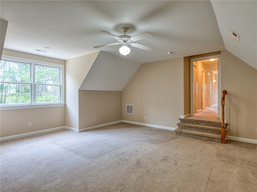 7914 O Neil Road Gloucester, VA 23061 - Photo 37 of 47 Bonus room with ceiling fan, vaulted ceiling, and light carpet