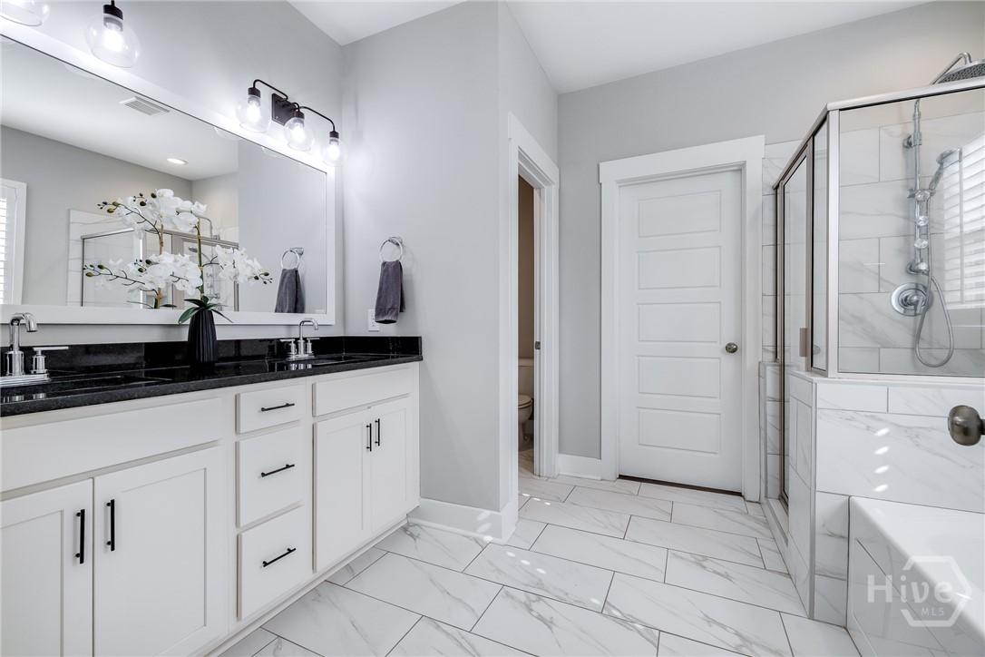 119 Danbury Court Pooler, GA 31322 - Photo 21 of 37 Primary Bathroom - Duel Vanities, water closet, Large walk in custom closet.