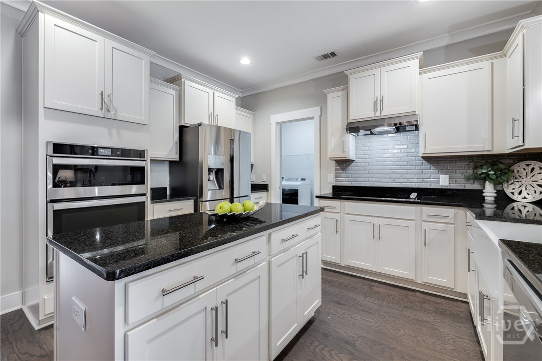 119 Danbury Court Pooler, GA 31322 - Photo 9 of 37 Kitchen -storage galore, view of laundry room that also houses upgraded pantry