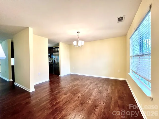 a view of a livingroom with wooden floor