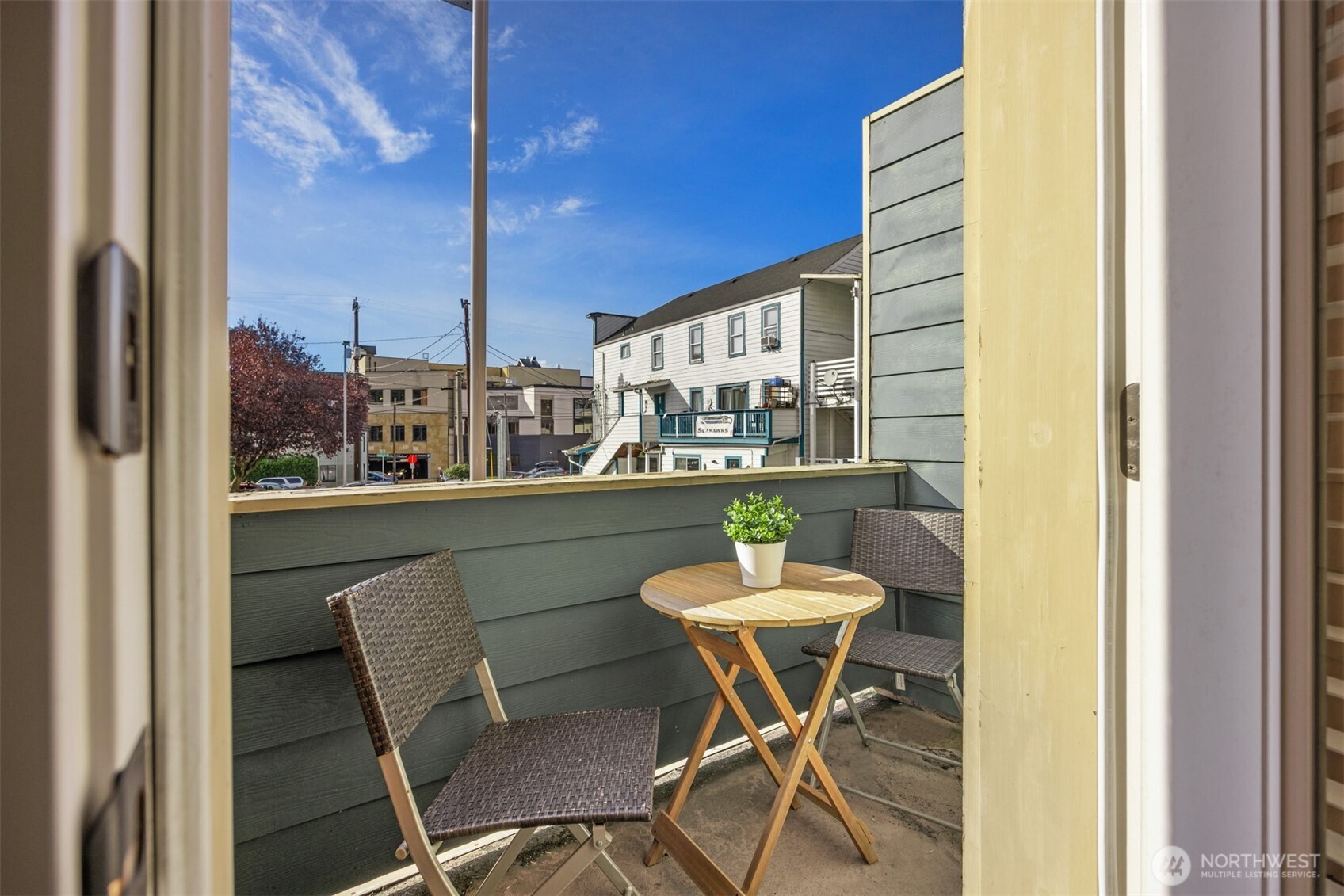 5233 Russell Avenue Northwest, Unit A Seattle, WA 98107 - Photo 11 of 29 a view of a dining room with furniture and a window