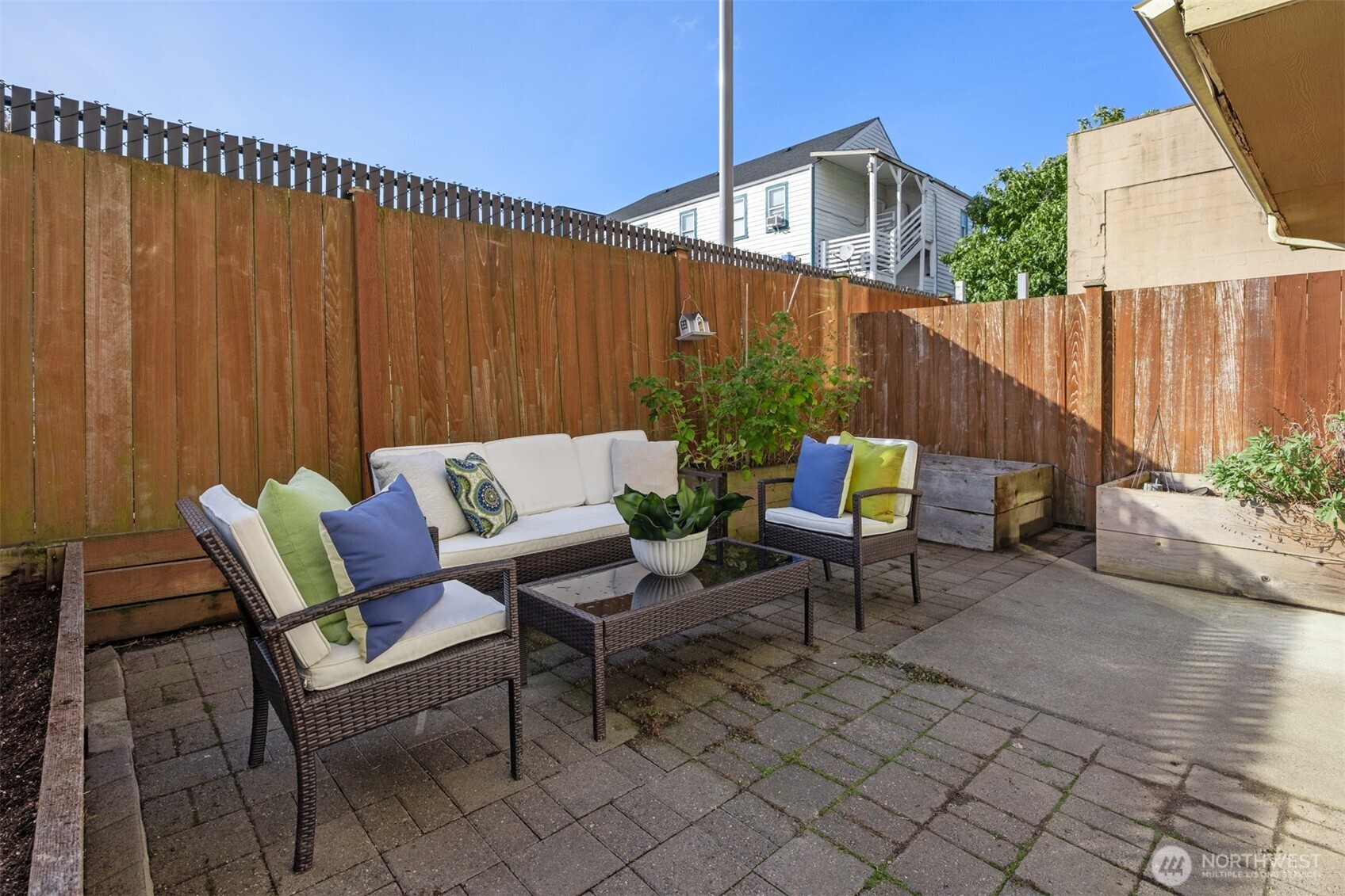 5233 Russell Avenue Northwest, Unit A Seattle, WA 98107 - Photo 13 of 29 a backyard of a house with outdoor seating