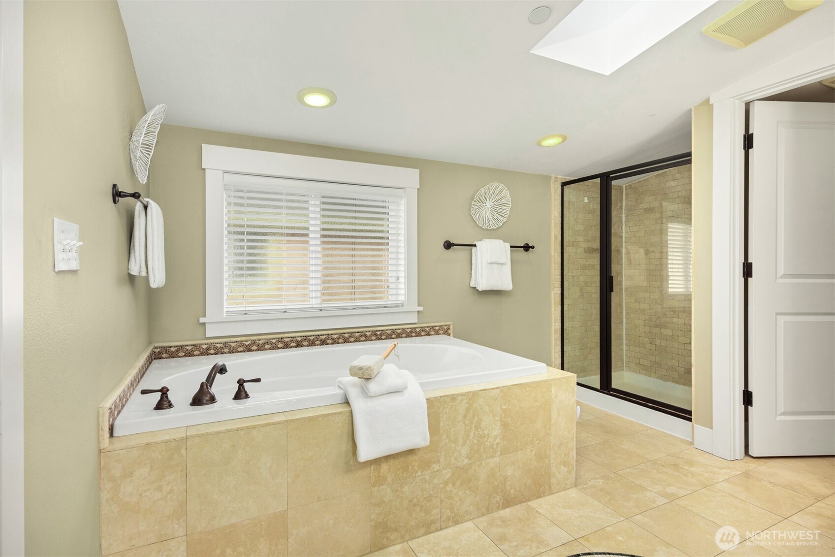 5233 Russell Avenue Northwest, Unit A Seattle, WA 98107 - Photo 20 of 29 a bathroom with a bathtub and a shower