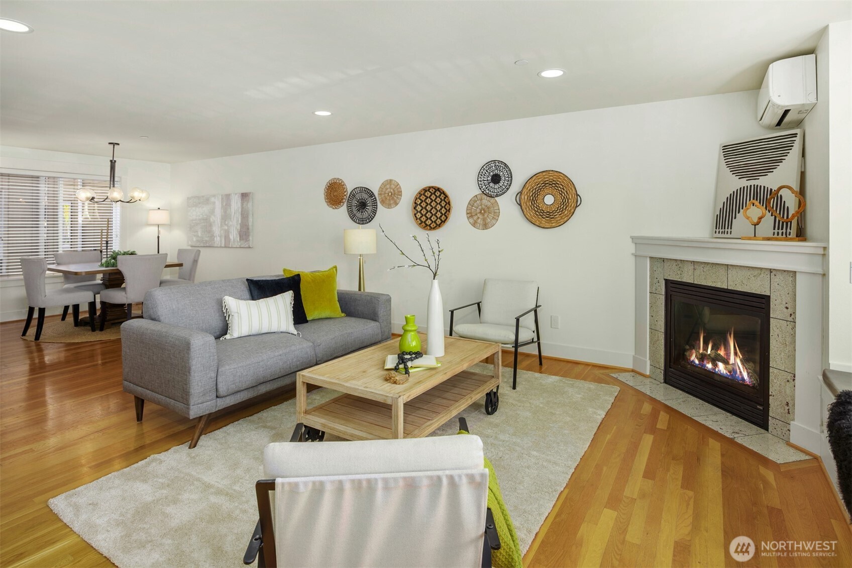 5233 Russell Avenue Northwest, Unit A Seattle, WA 98107 - Photo 7 of 29 a living room with furniture and a fireplace