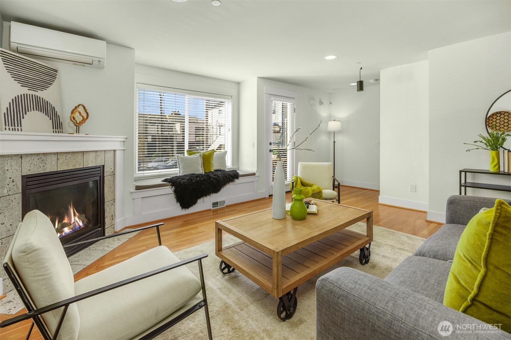 5233 Russell Avenue Northwest, Unit A Seattle, WA 98107 - Photo 10 of 29 a living room with furniture and a fireplace