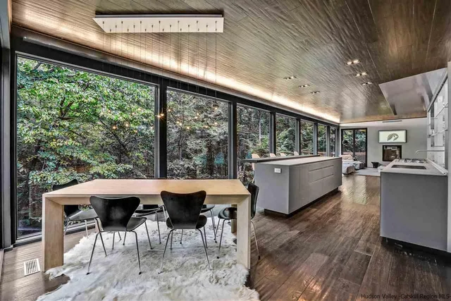 a bedroom with bed and a large mirror