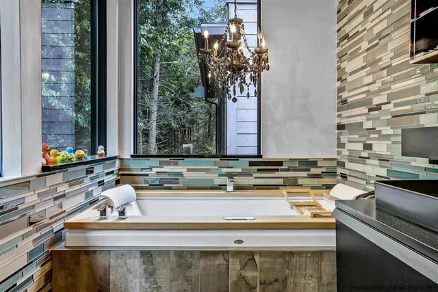 a kitchen with stainless steel appliances a sink and a stove
