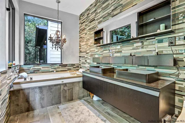 a hallway with wooden floor closet and book shelf