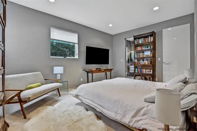 a bathroom with a sink toilet and window