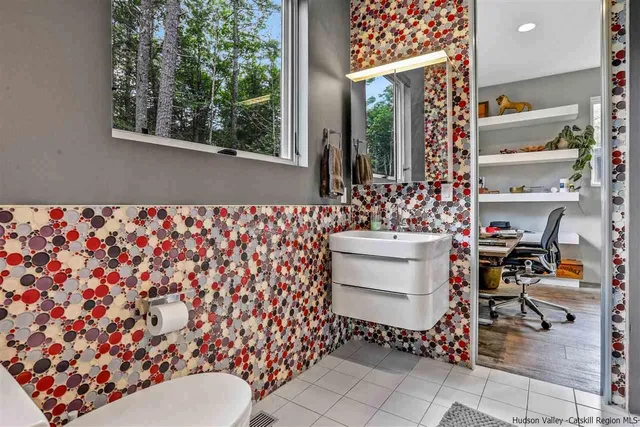 a bathroom with a bathtub and shower curtain