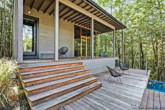 a view of balcony with wooden floor and seating space