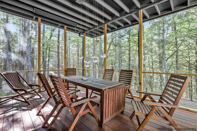 a view of backyard with outdoor seating