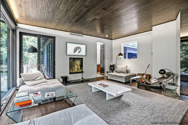 a bedroom with furniture or couch and a potted plant