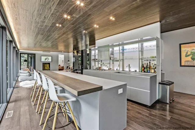 a very nice looking dining room with a large window