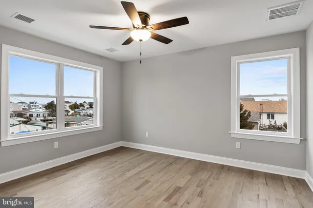 a view of an empty room with a fireplace