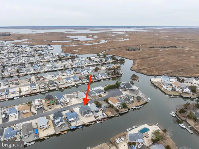 a balcony with table and chairs